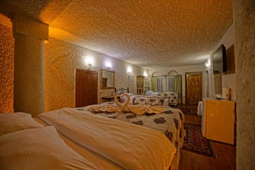 Katil atau katil-katil dalam bilik di Melek Cave Hotel