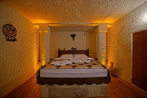 Katil atau katil-katil dalam bilik di Melek Cave Hotel