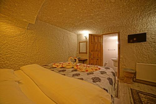 Katil atau katil-katil dalam bilik di Melek Cave Hotel