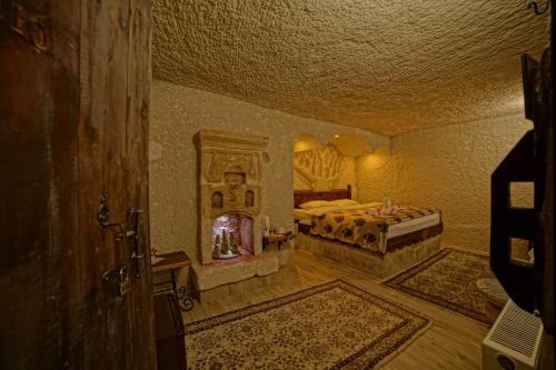 Katil atau katil-katil dalam bilik di Melek Cave Hotel
