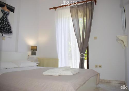 A bed or beds in a room at Chania Lissosaparments