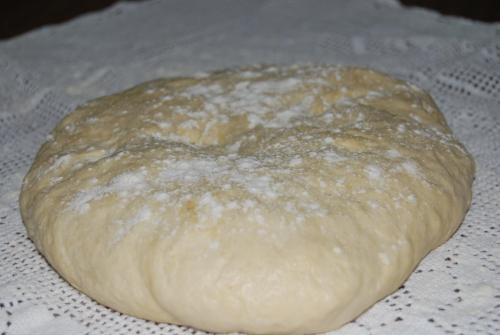 a loaf of bread sitting on top of a table at Tritoxo Guesthouse in Koukouli