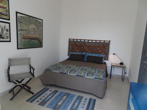 Ένα ή περισσότερα κρεβάτια σε δωμάτιο στο Casa Paloma Charme