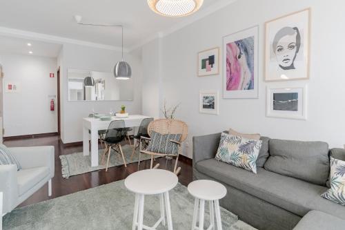 a living room with a couch and a table at Santa Catarina II by An Island Apart in Funchal