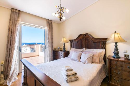 En eller flere senge i et værelse på Villa Melia