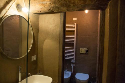 a bathroom with a sink and a toilet at La Canonica - charming self-catering apartments in Nizza Monferrato in Nizza Monferrato