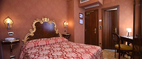 Postel nebo postele na pokoji v ubytování Hotel Ateneo