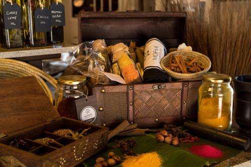 a box filled with spices and other items on a table at Essque Zalu Zanzibar in Nungwi