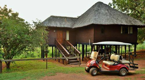 a small car parked in front of a house at Elephant Walk Retreat in Komatipoort