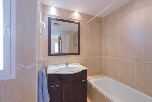 a bathroom with a sink and a tub and a mirror at Bello Naranjo, Puerto Banus Los naranjos de Marbella in Marbella