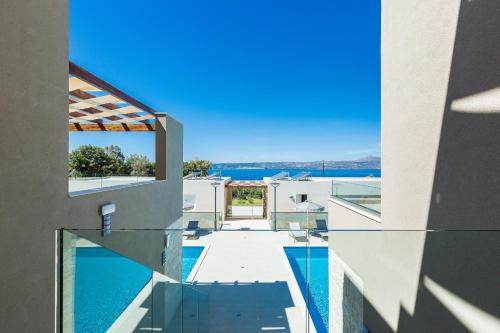 a view of a house with a swimming pool at Sun and Sea Plus Resort in Plaka