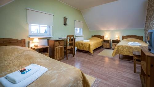Un pat sau paturi într-o cameră la Sangaste Rukki Maja Guesthouse