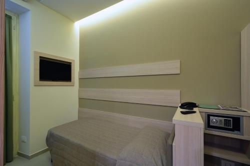 Postel nebo postele na pokoji v ubytování Hotel Eden