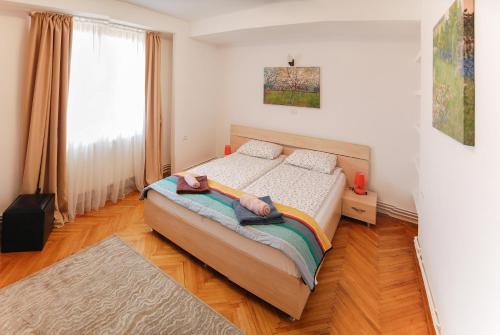 Postel nebo postele na pokoji v ubytování Stay Inn Center Timisoara