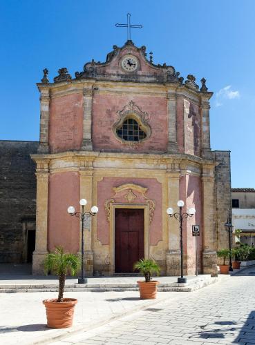 an old church with a cross on top of it at Casale del Forno in Andrano