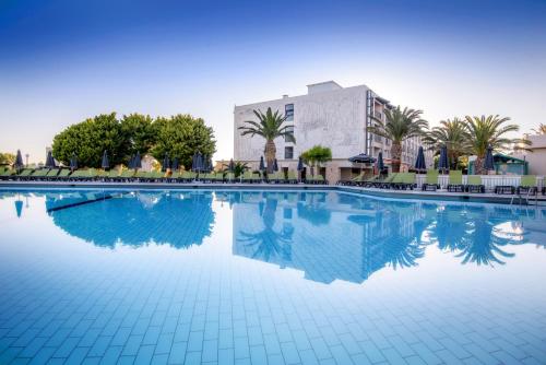 a large swimming pool in front of a building at Sol Marina Beach Crete in Gouves