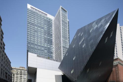 a view of two tall buildings in a city at Four Seasons Hotel San Francisco in San Francisco