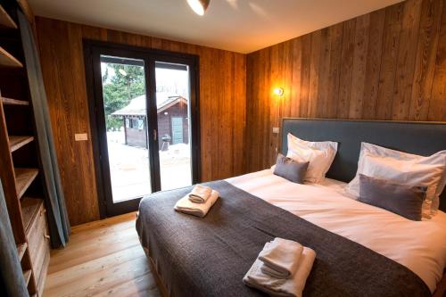 Voodi või voodid majutusasutuse Stunning Views Chamonix toas