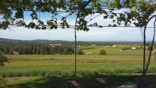 a view of a green field from a tree at Masmazan in Mazan