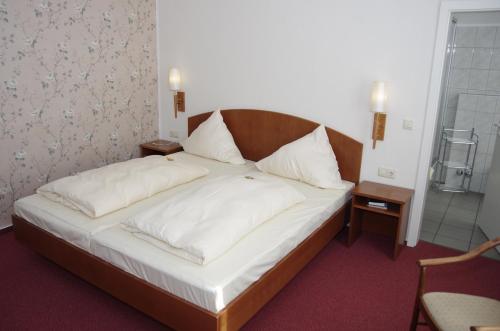 Ένα ή περισσότερα κρεβάτια σε δωμάτιο στο Hotel Eichenhof