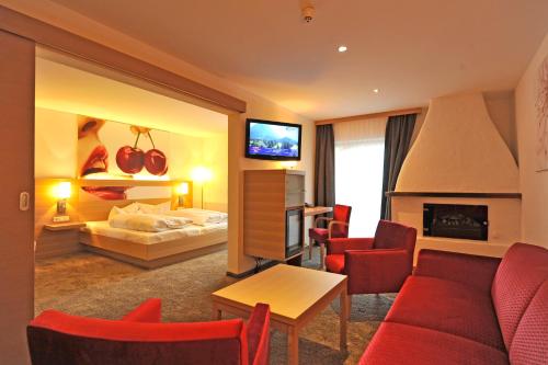 Postel nebo postele na pokoji v ubytování Geniesserhotel Alpin GmbH