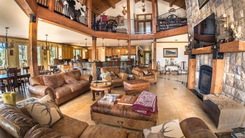 a large living room with couches and a fireplace at Elktrace Bed and Breakfast in Pagosa Springs