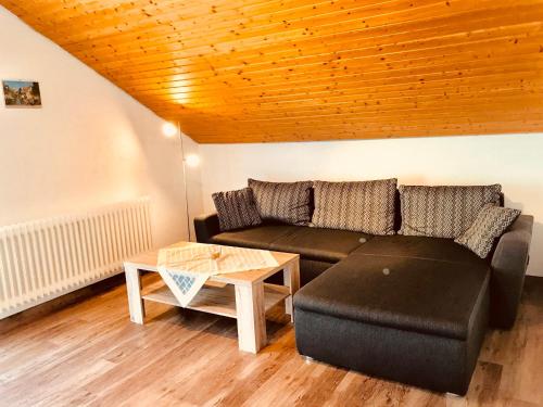 a living room with a couch and a table at Haus Brengartner in Münstertal