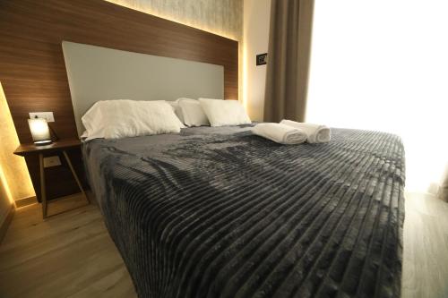 Letto o letti in una camera di 8room Hotel