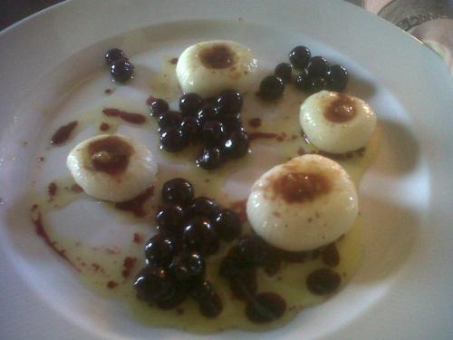 a plate of food with dumplings and berries on it at Agriturismo Cignale in Penne