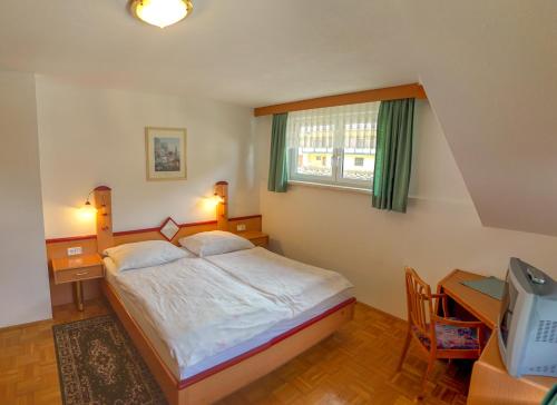 Postel nebo postele na pokoji v ubytování Gasthof Podobnik