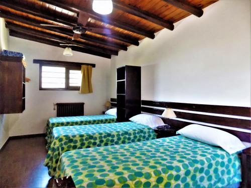 Posteľ alebo postele v izbe v ubytovaní Cabañas Albapampa