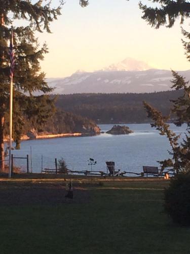 a park with a view of a lake with a mountain at The Bluff on Whidbey in Oak Harbor