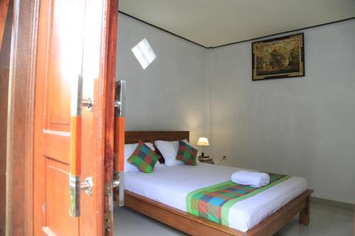 Ein Bett oder Betten in einem Zimmer der Unterkunft Pondok Gepokan Homestay