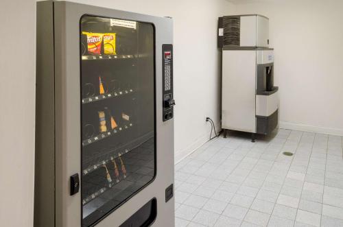 a refrigerator with drinks in it in a room at Motel 6-Mobile, AL in Tillmans Corner