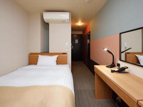Postel nebo postele na pokoji v ubytování Belmont Hotel