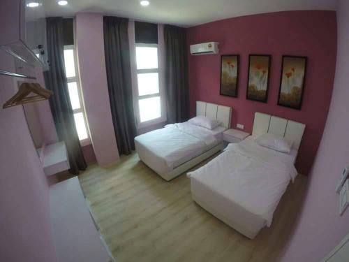 Postel nebo postele na pokoji v ubytování Xenia Homestay