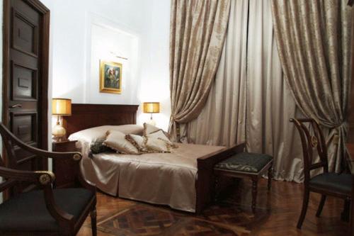 Postel nebo postele na pokoji v ubytování Scala Boutique-Hotel