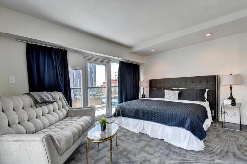 a large bedroom with a bed and a couch at Littlefield Lofts #701 in Austin