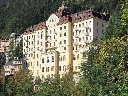 a large building on the side of a mountain at Executive Apartement Gastein in Bad Gastein