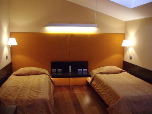 Кровать или кровати в номере Kokoshkovata Boutique House