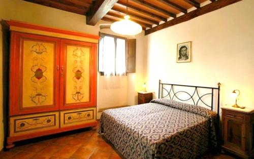 En eller flere senge i et værelse på Podere Grossi