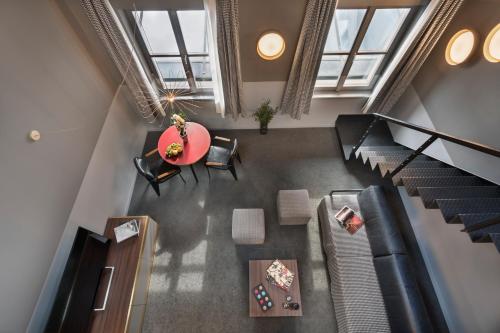 an overhead view of a loft with a table and chairs at Stories Boutique Hotel in Budapest