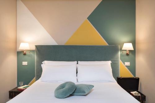 Postel nebo postele na pokoji v ubytování Boutique Hotel Galatea