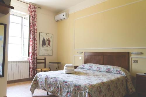 Postel nebo postele na pokoji v ubytování Agriturismo Rivoli