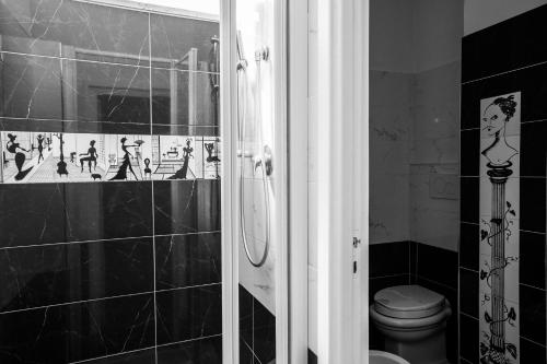 a bathroom with a shower and a toilet in it at Hotel Residenza In Farnese in Rome