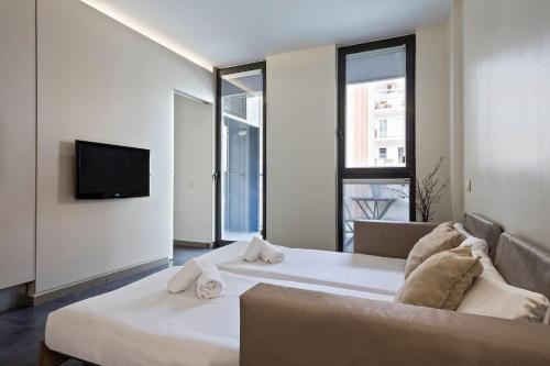 Llit o llits en una habitació de Aparthotel Bcn Montjuic