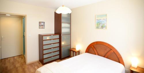 Ένα ή περισσότερα κρεβάτια σε δωμάτιο στο Appart' Dauphiné