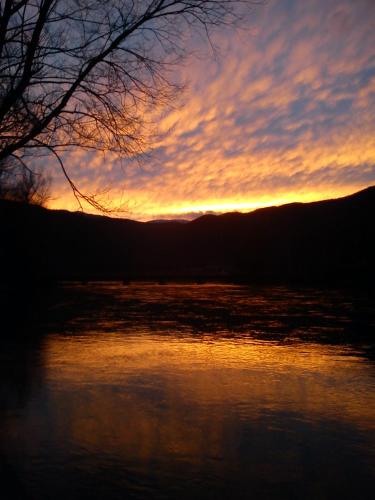a sunset over a body of water at Vacation Home Pliva in Šipovo