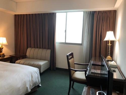 Ένα ή περισσότερα κρεβάτια σε δωμάτιο στο Hotel RegaLees
