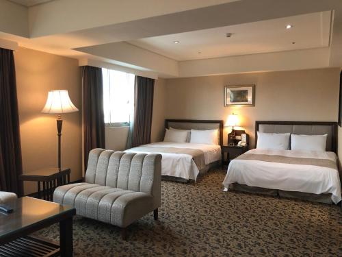 Ένα ή περισσότερα κρεβάτια σε δωμάτιο στο Hotel RegaLees